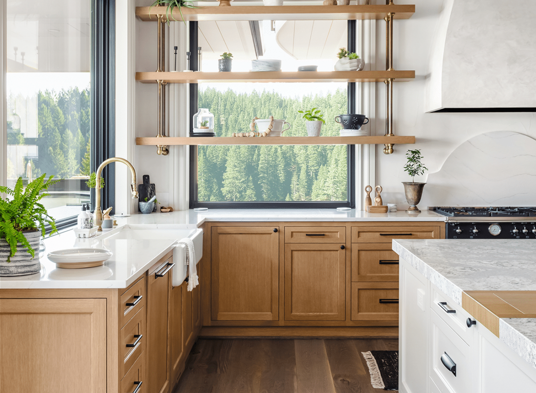 Natural Wood Cabinets Paired With White Island In Kitchen